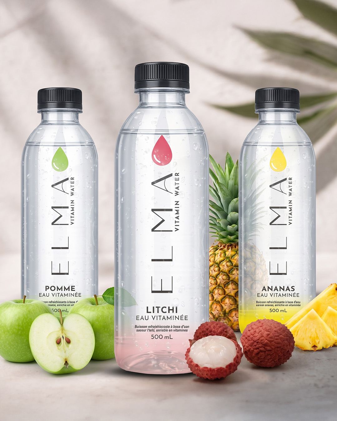 Trio of ELMA bottles with fresh fruit